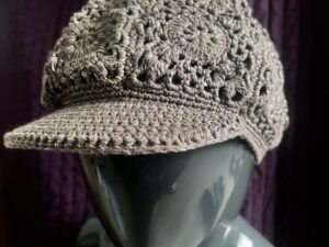 Crochet style peaked hat